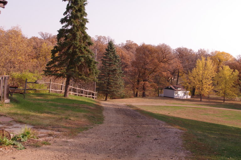 Path through the grounds with rustic fence